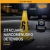 Vehículo Nissan Tsuru blanco con franjas verdes asegurado en operativo contra narcomenudeo zitácuaro