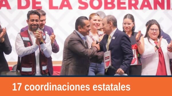 Carlos Torres Piña rindiendo protesta como titular de la coordinación estatal michoacán durante evento en Ciudad de México